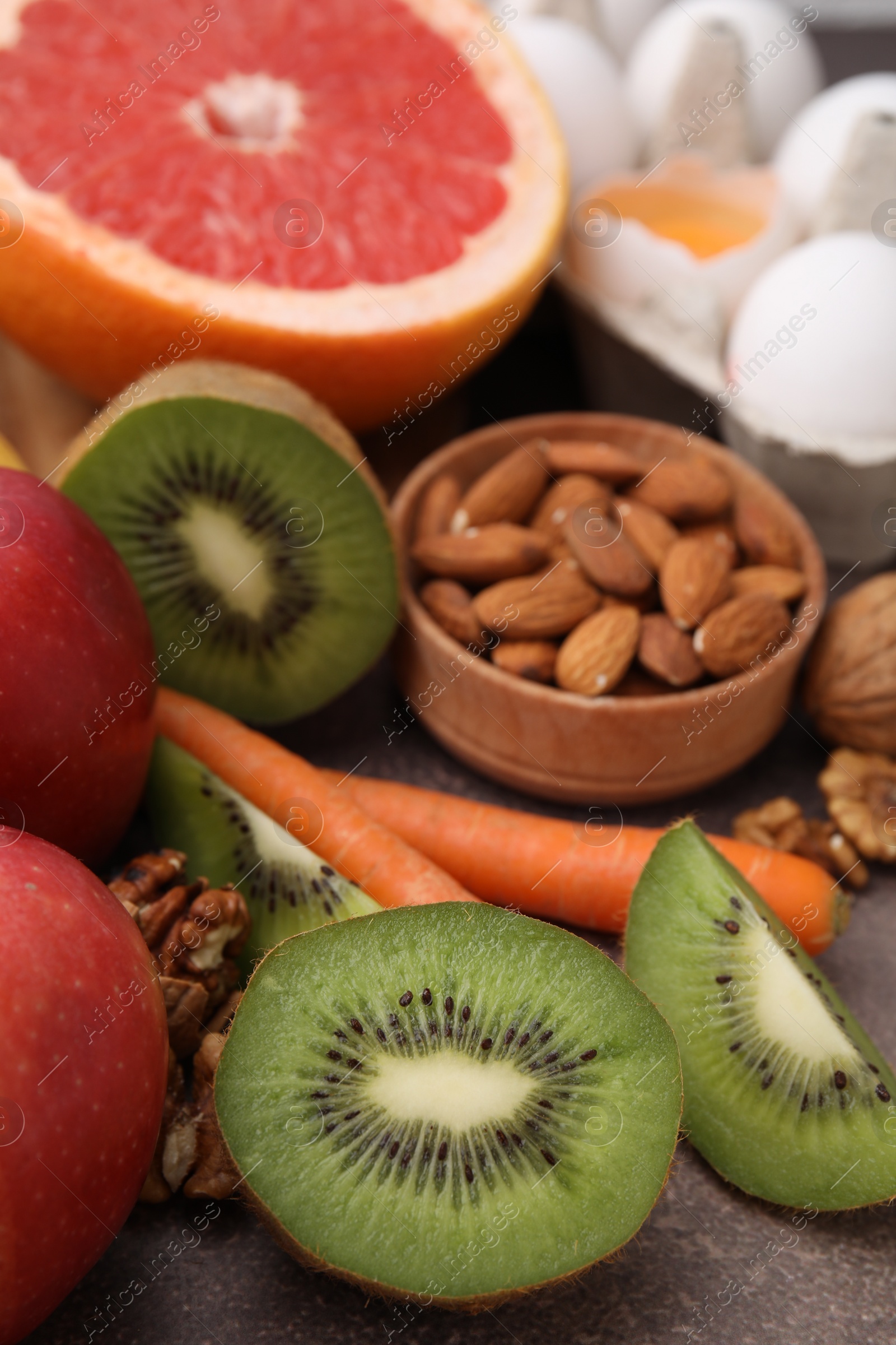 Photo of Many different products on brown table, closeup. Natural sources of serotonin