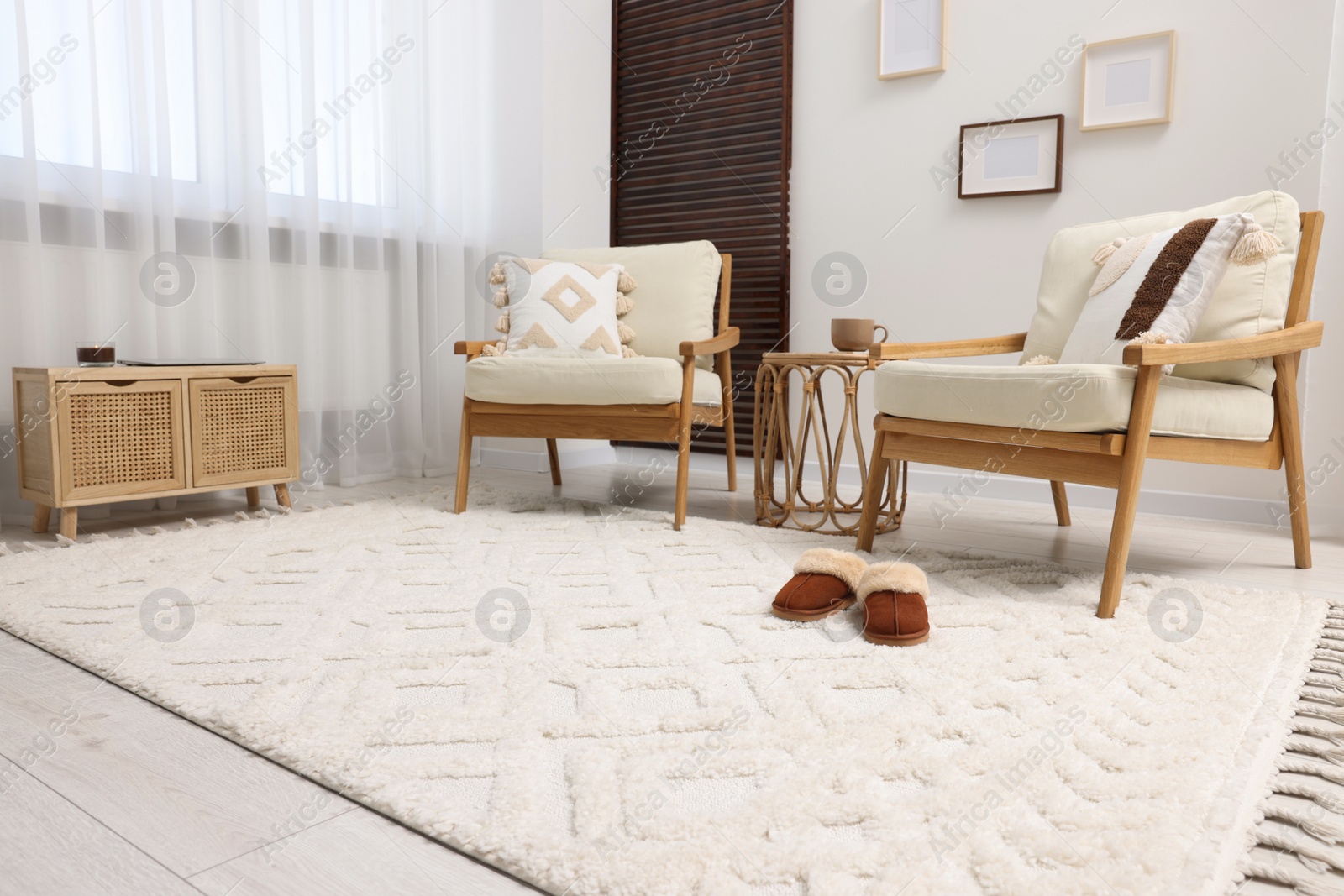 Photo of Stylish living room with soft white carpet and furniture. Interior design