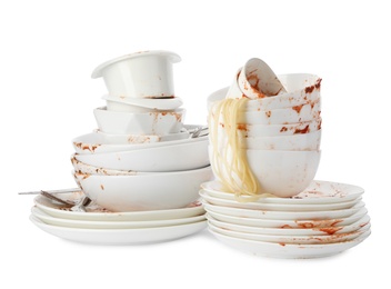 Photo of Set of dirty dishes with spaghetti leftovers isolated on white