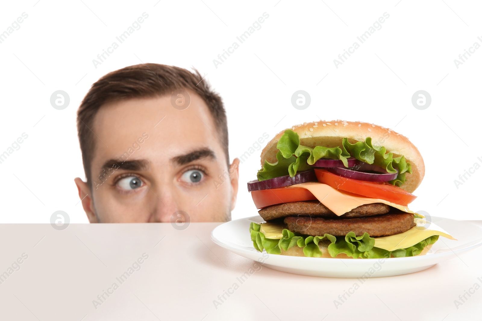 Photo of Young man with tasty burger on white background