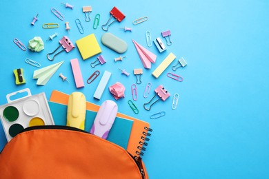 Photo of Back to school. Many different school stationery and paper planes on light blue background, flat lay with space for text