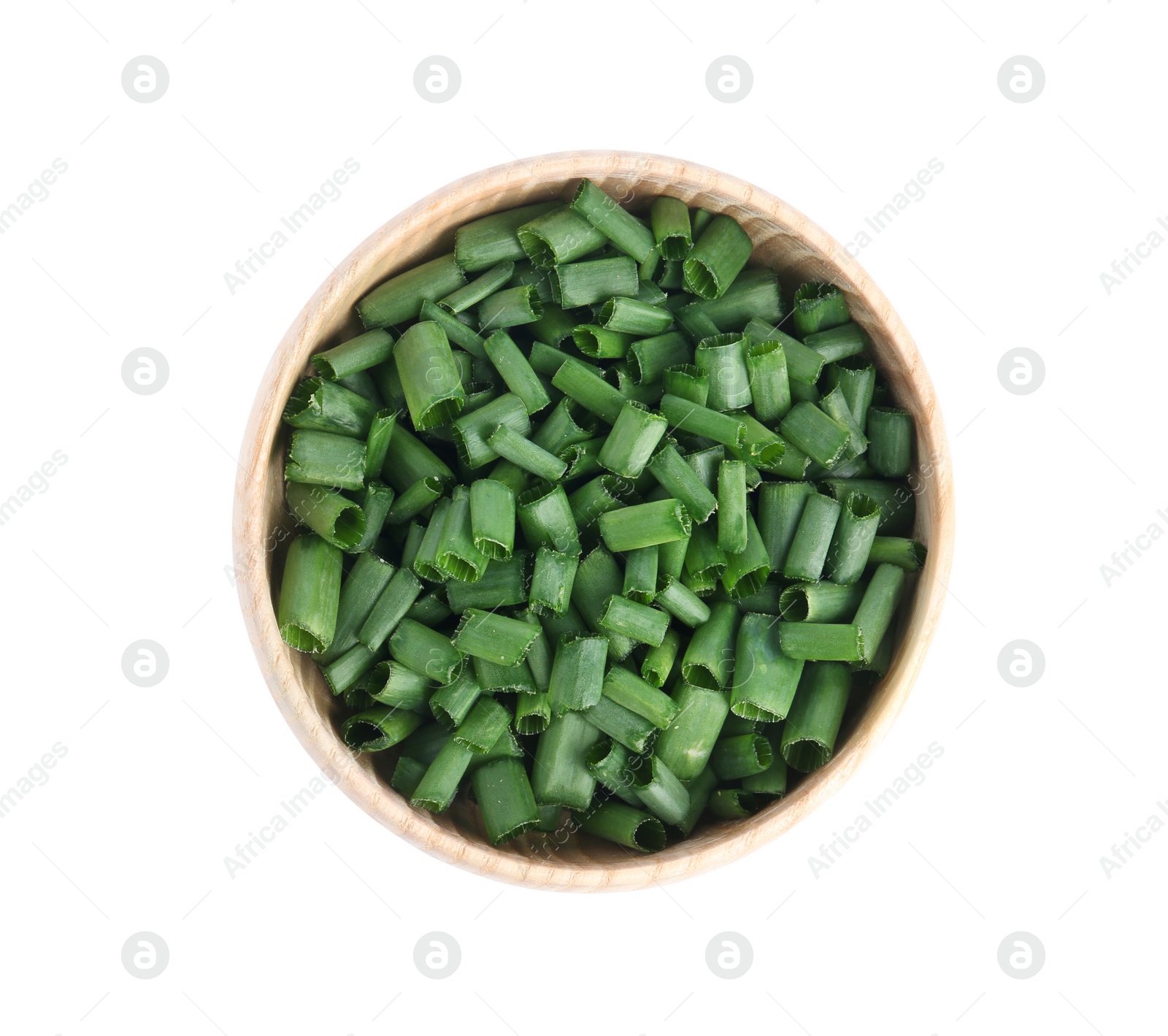 Photo of Cut green spring onion in wooden bowl isolated on white, top view