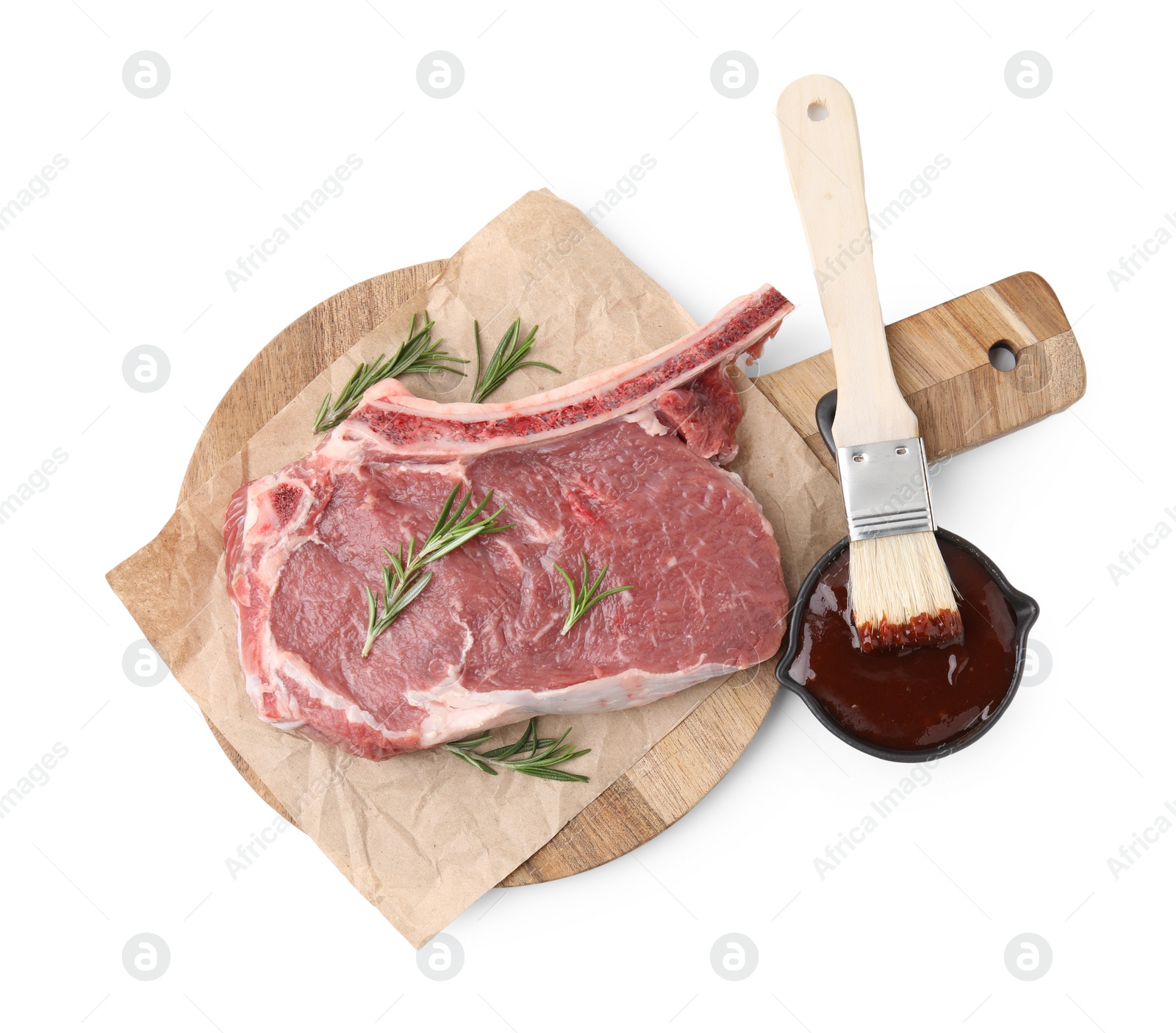 Photo of Board with raw meat, rosemary and marinade isolated on white, top view