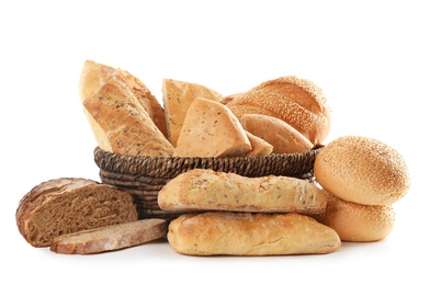 Photo of Different kinds of bread and wicker basket on white background