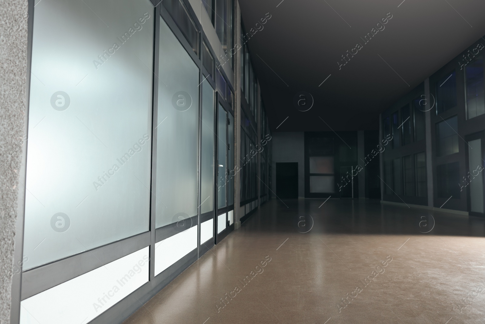 Photo of Modern empty office corridor with glass walls