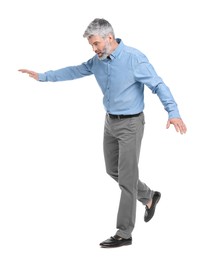 Photo of Mature businessman in stylish clothes posing on white background