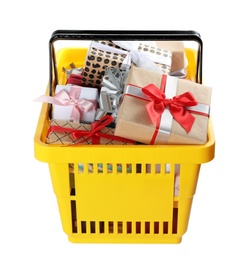 Photo of Shopping basket full of gift boxes on white background