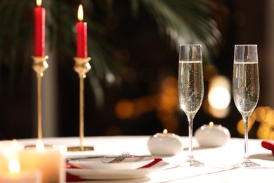 Romantic dinner table setting with glasses of champagne in restaurant