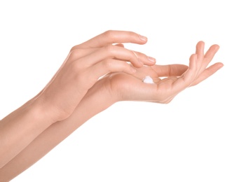 Photo of Young woman applying hand cream against on white background