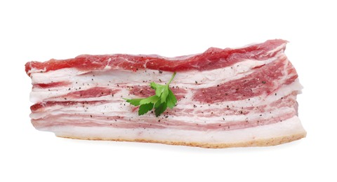 Photo of Slice of tasty pork fatback with spices and parsley isolated on white, top view