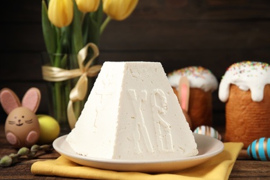 Traditional cottage cheese Easter paskha on wooden table