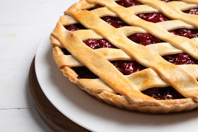 Photo of Delicious fresh cherry pie on white table, closeup