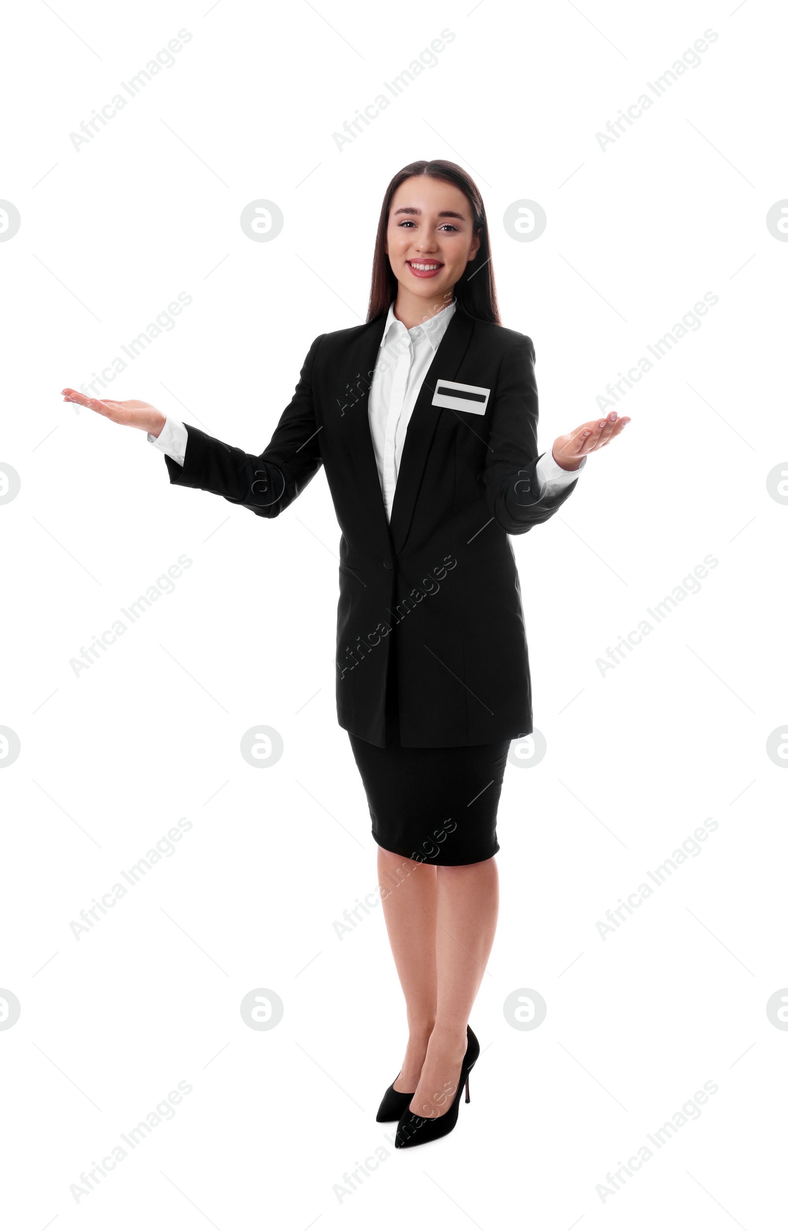 Photo of Full length portrait of happy young receptionist in uniform on white background