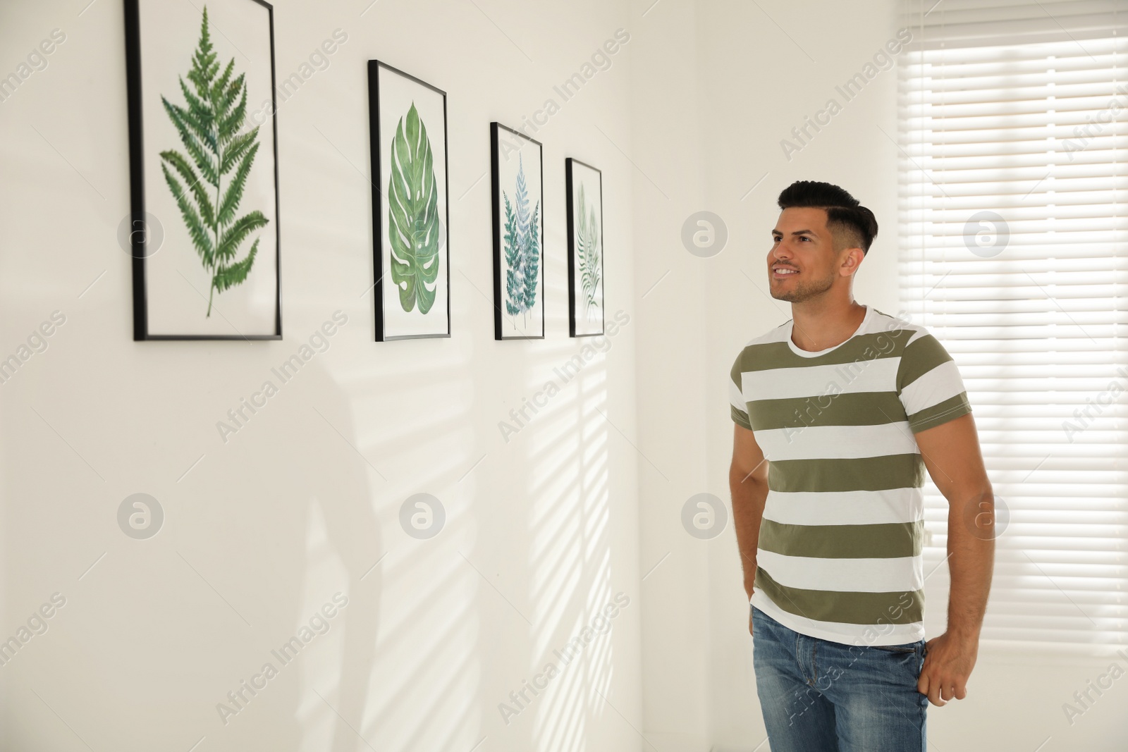 Photo of Happy man at exhibition in art gallery