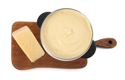 Photo of Fondue with tasty melted cheese and piece isolated on white, top view