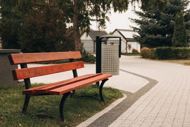 Beautiful trees, pathway and bench in park