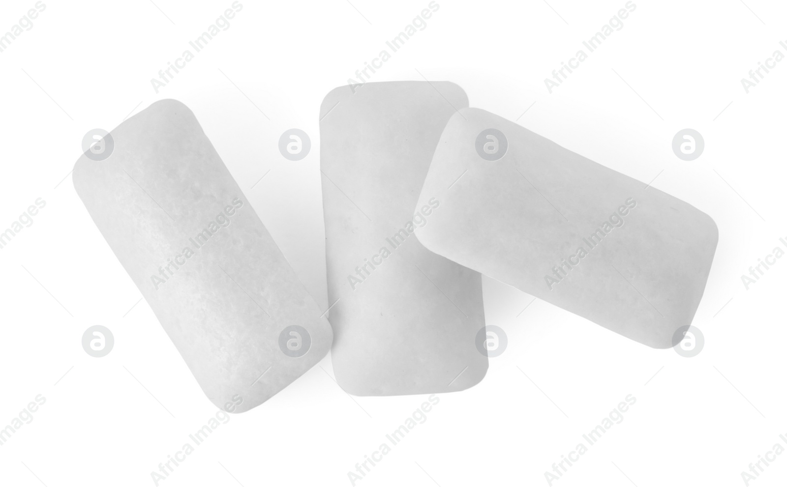 Photo of Tasty chewing gums on white background, top view