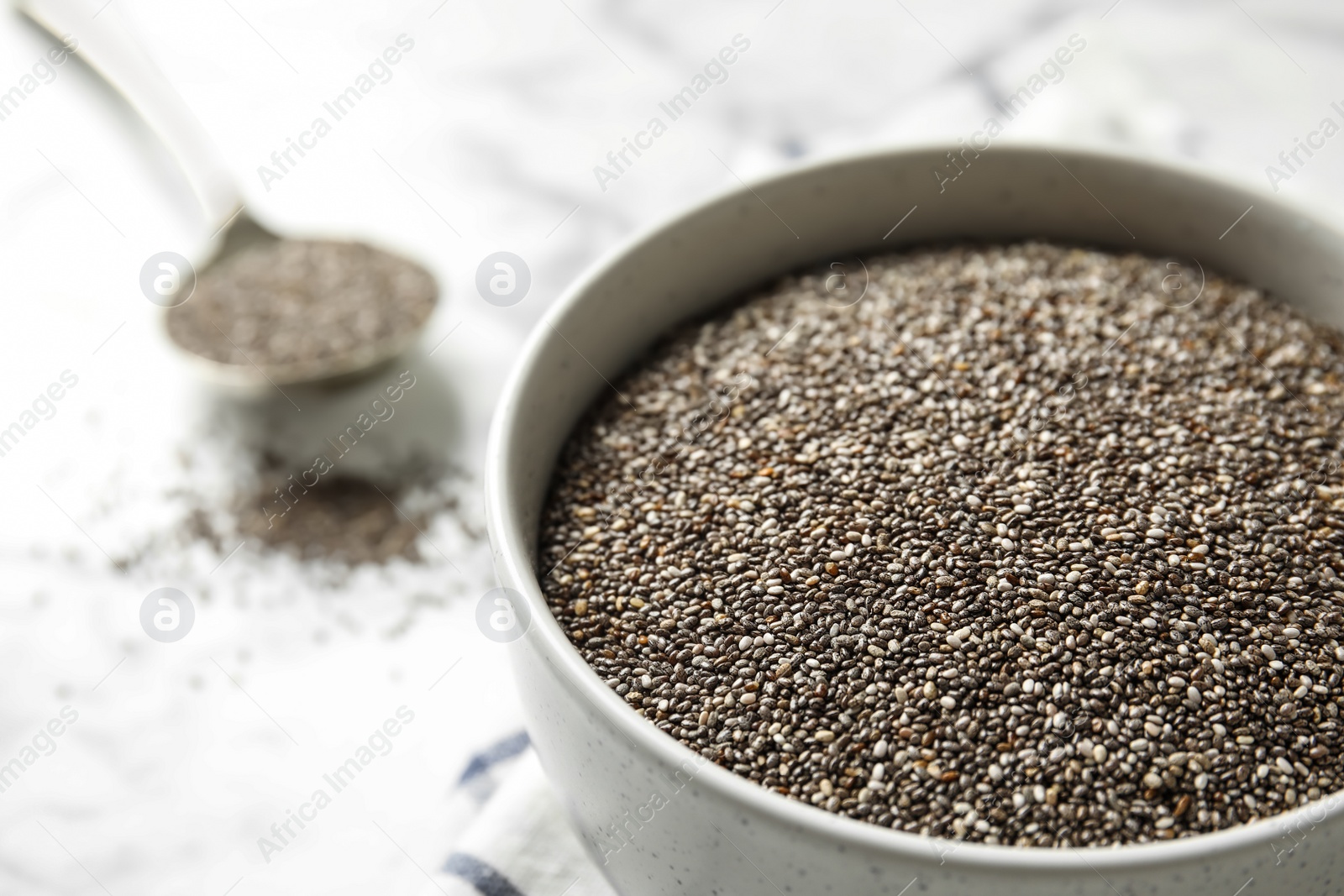 Photo of Bowl with chia seeds on table, closeup. Space for text