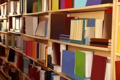 Image of Collection of different books on shelves in library