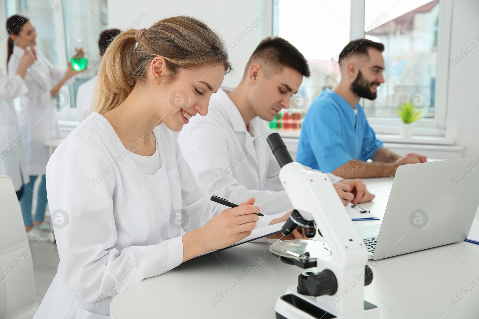 Photo of Medical students working in modern scientific laboratory