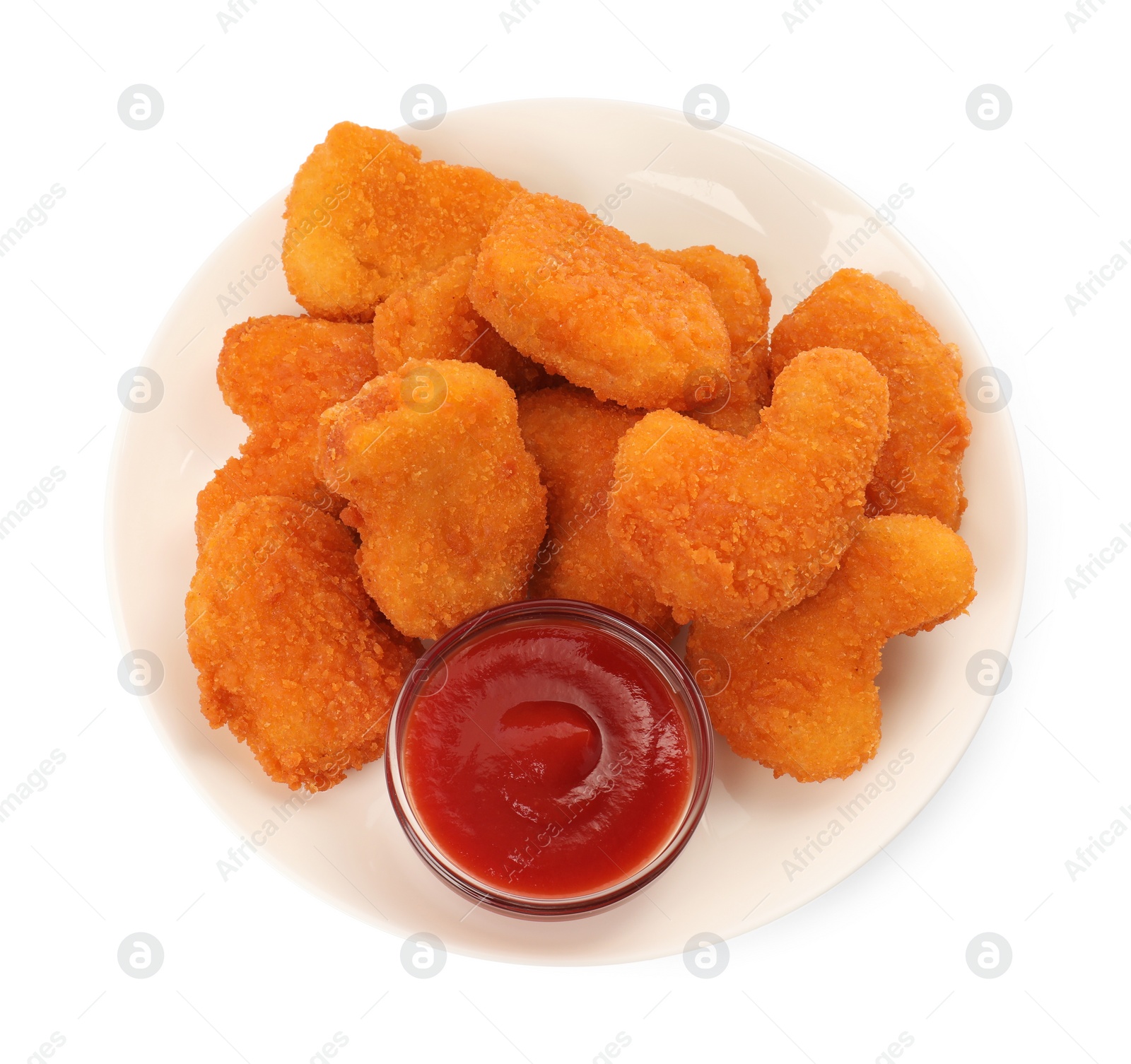 Photo of Plate of tasty chicken nuggets with ketchup isolated on white, top view