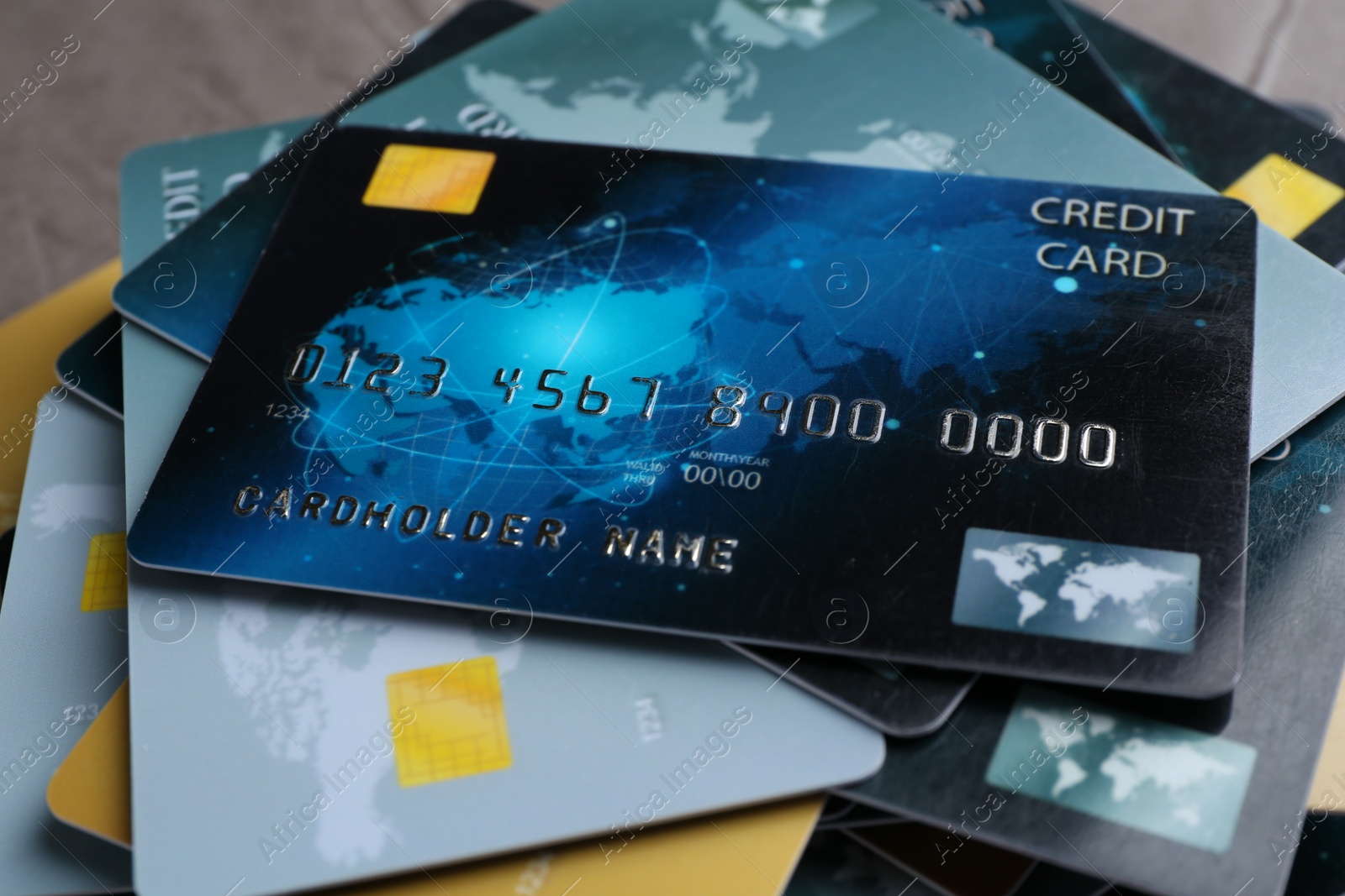 Photo of Many credit cards on grey table, closeup