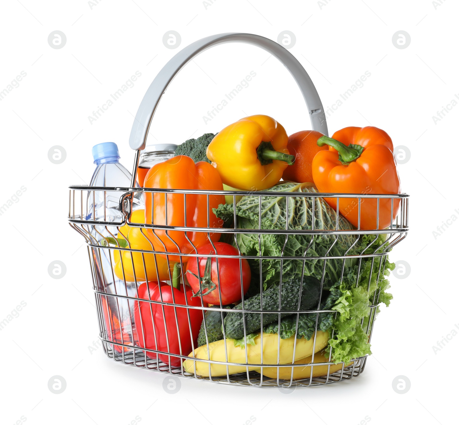 Photo of Shopping basket with grocery products on white background