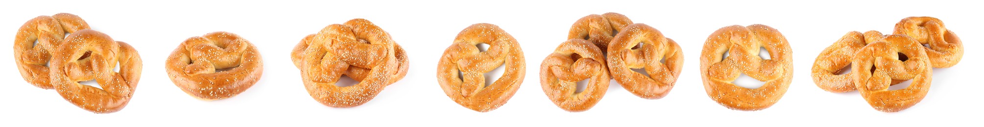 Image of Set with tasty freshly baked pretzels on white background. Banner design