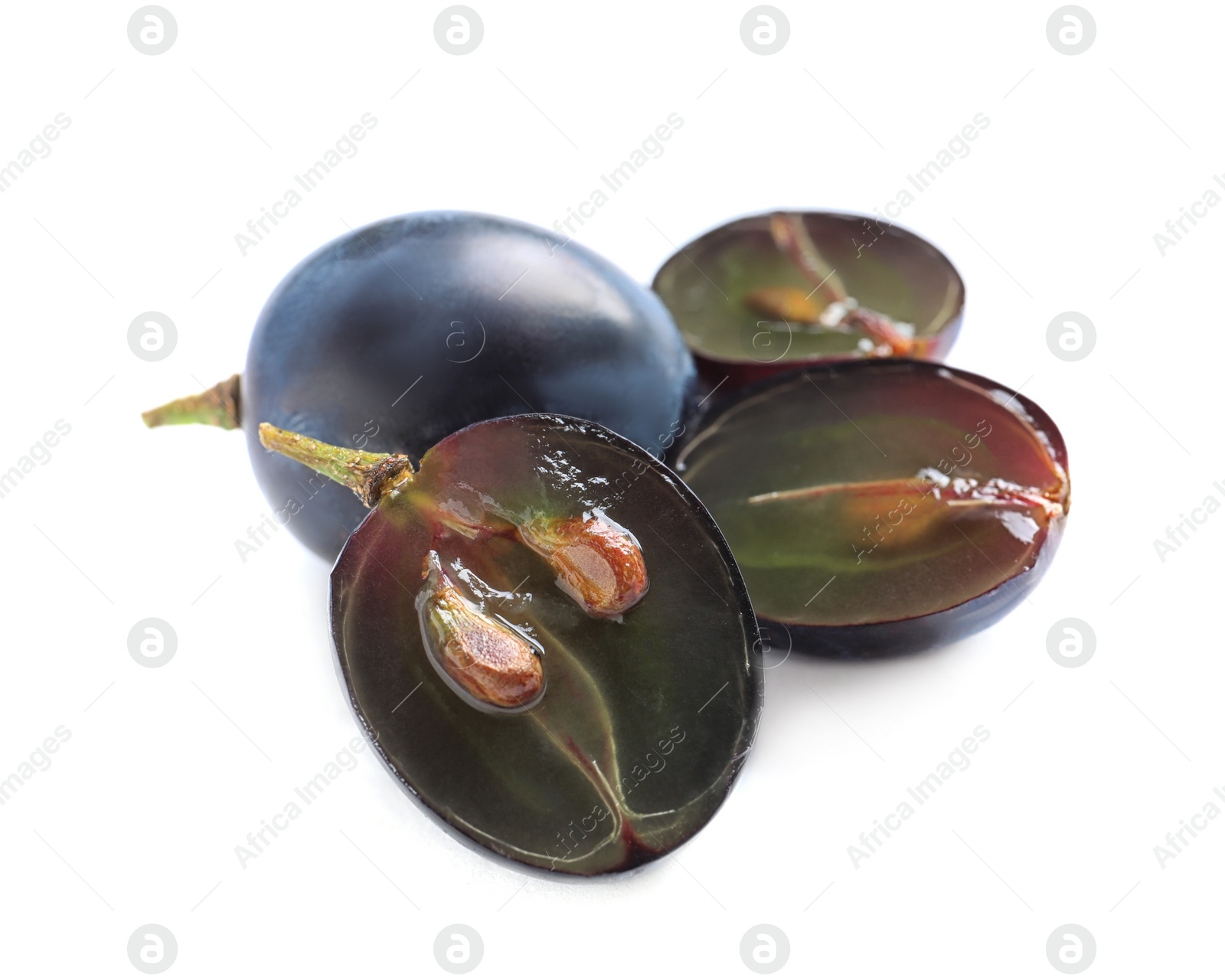 Photo of Cut and whole fresh ripe juicy grapes with seeds on white background