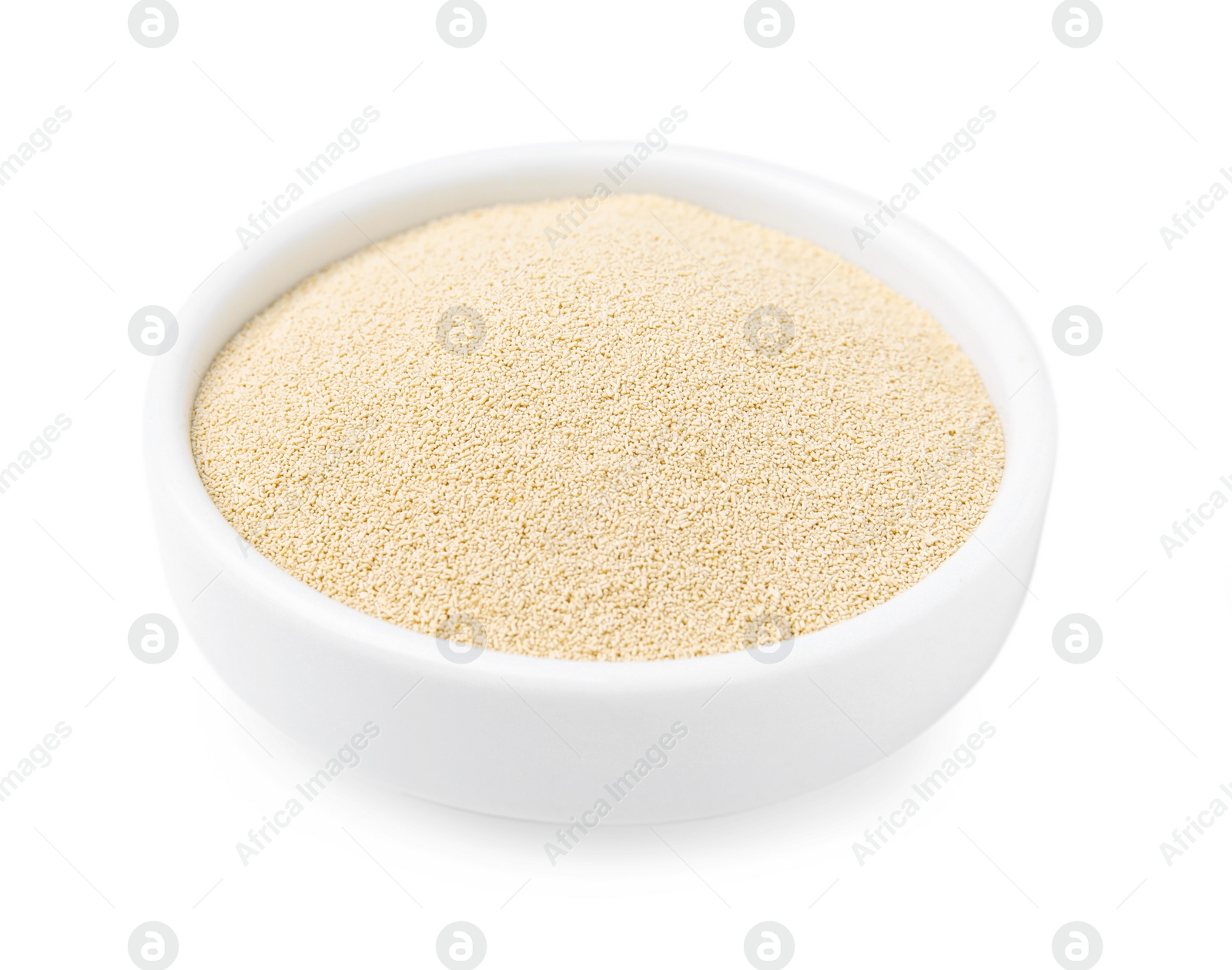 Photo of Granulated yeast in bowl on white background