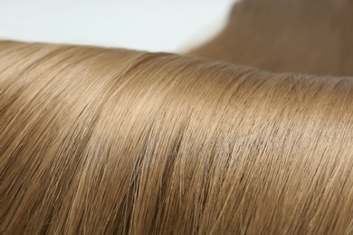 Photo of Beautiful light brown hair, closeup view. Professional hairdresser