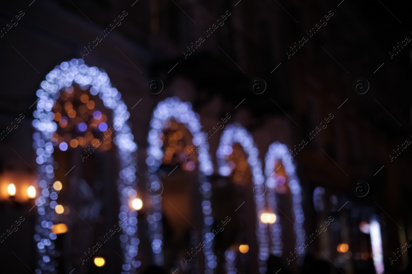 Photo of Blurred view of building with beautiful street lights at night. Bokeh effect