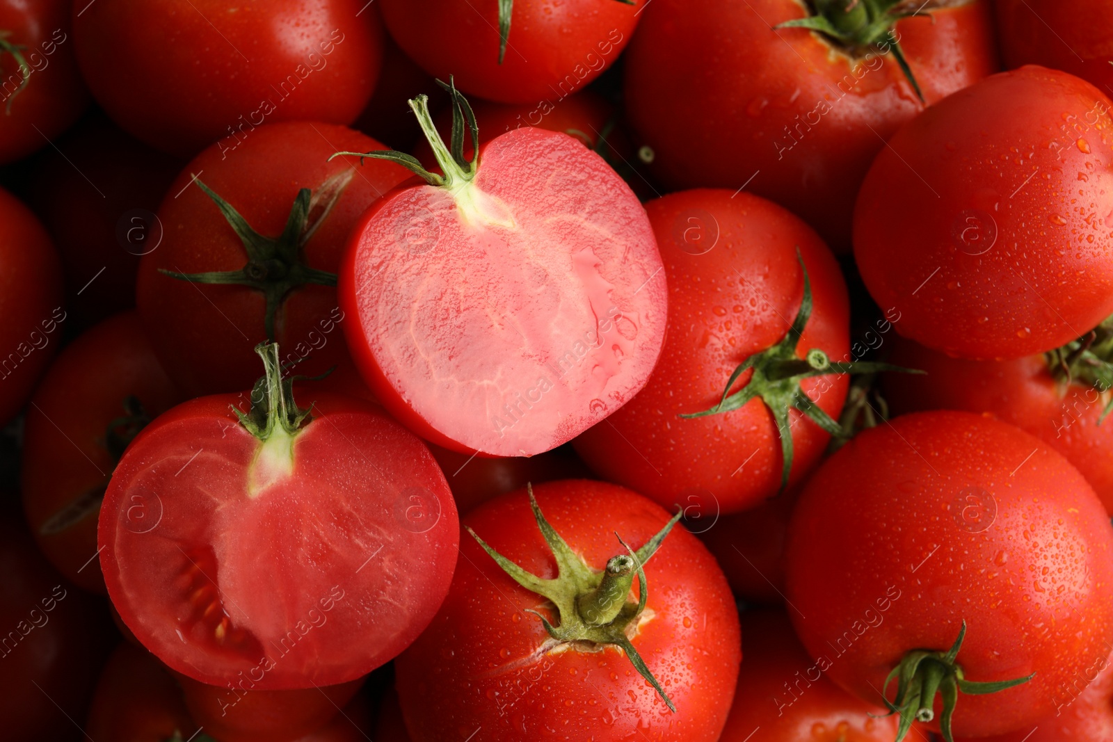 Photo of Fresh ripe red tomatoes as background, closeup