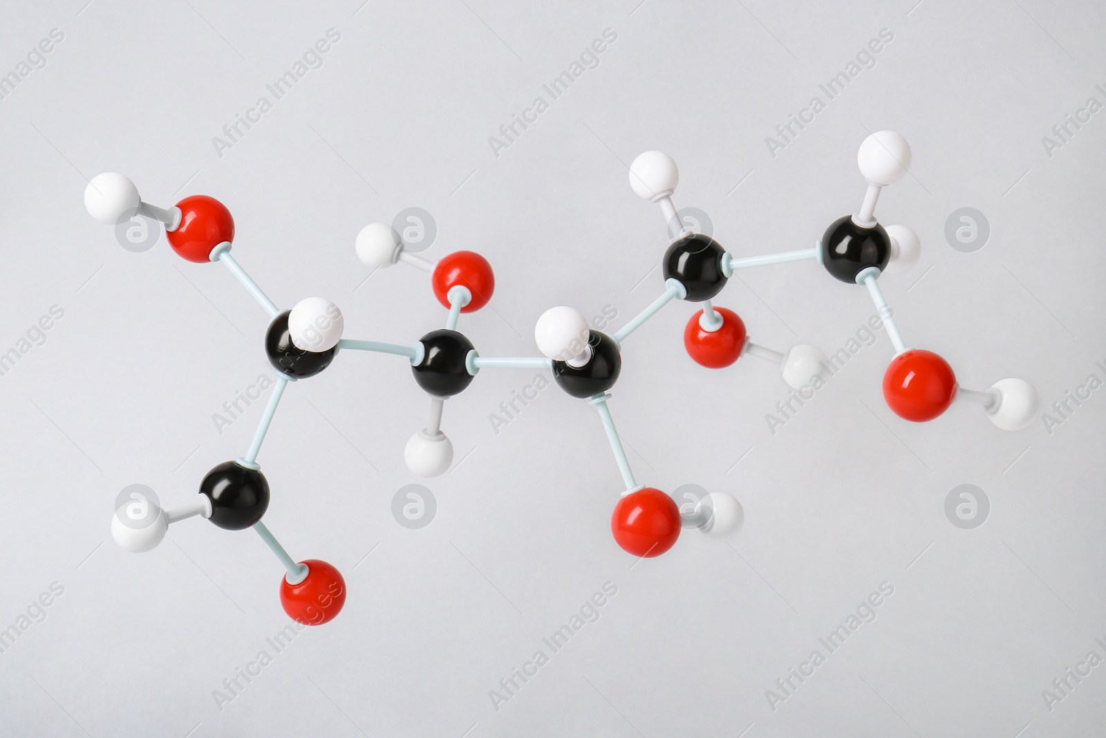Photo of Molecule of glucose on light grey background. Chemical model