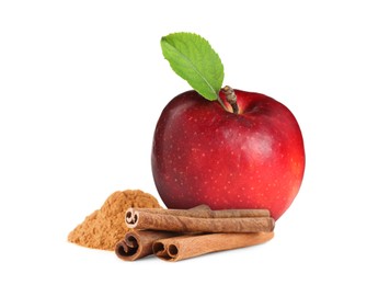 Aromatic cinnamon sticks, powder and red apple isolated on white