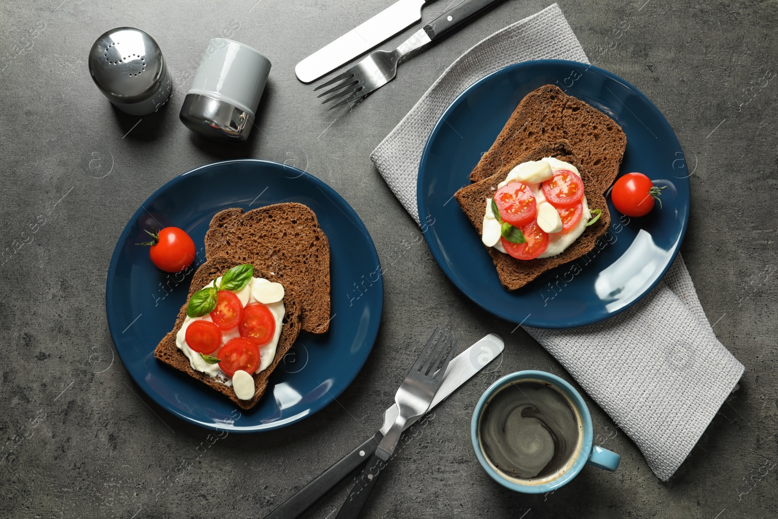 Photo of Flat lay composition with toast bread and tableware on grey background