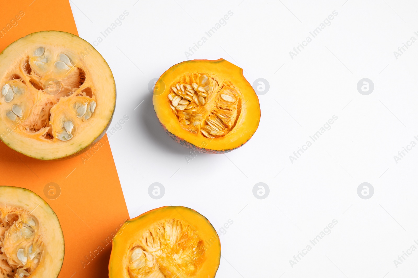 Photo of Fresh ripe pumpkins on color background, flat lay with space for text. Holiday decoration