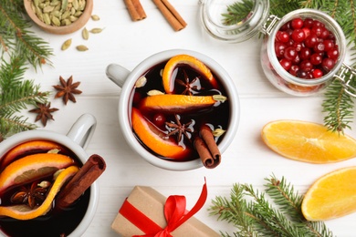 Photo of Flat lay composition with aromatic mulled wine on white wooden table