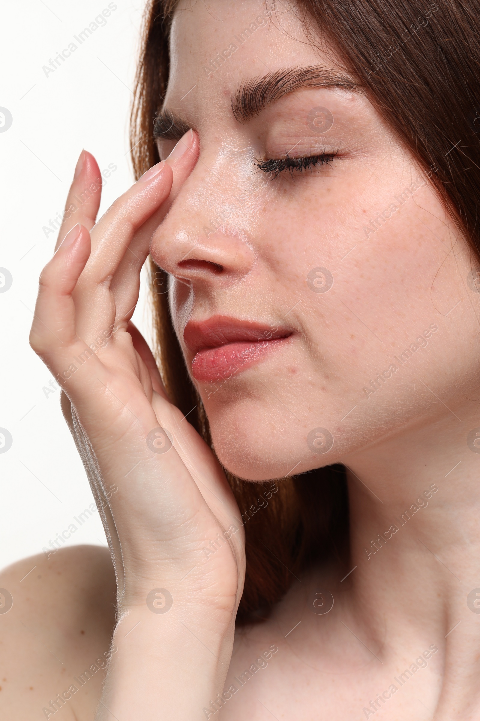 Photo of Beautiful woman with freckles on white background, closeup