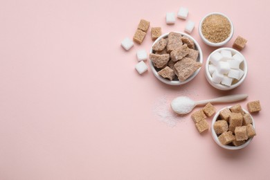 Photo of Different types of sugar on pink background, flat lay. Space for text