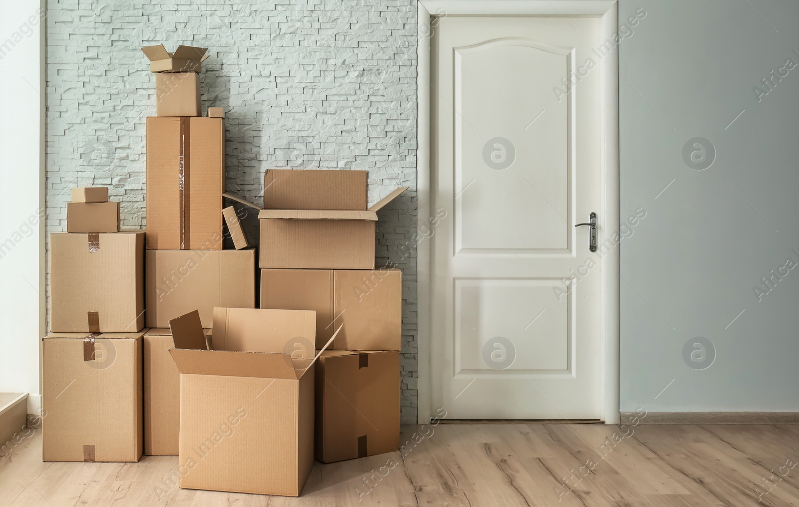 Photo of Cardboard boxes on floor indoors