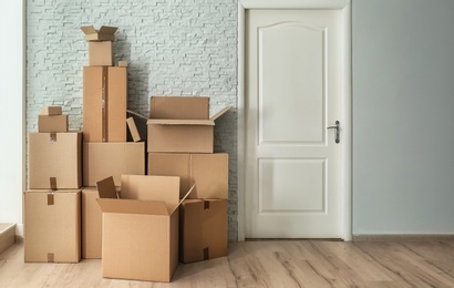 Photo of Cardboard boxes on floor indoors