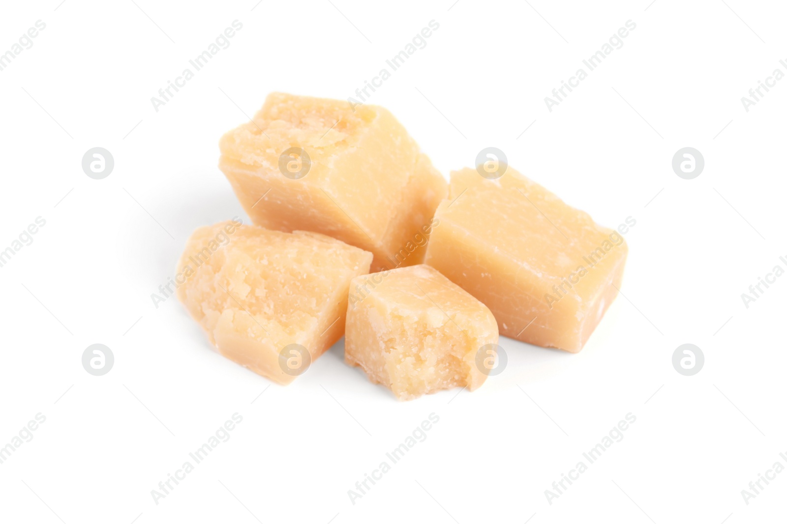 Photo of Pieces of delicious parmesan cheese on white background