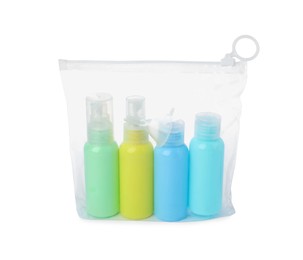 Cosmetic travel kit in plastic bag isolated on white. Bath accessories