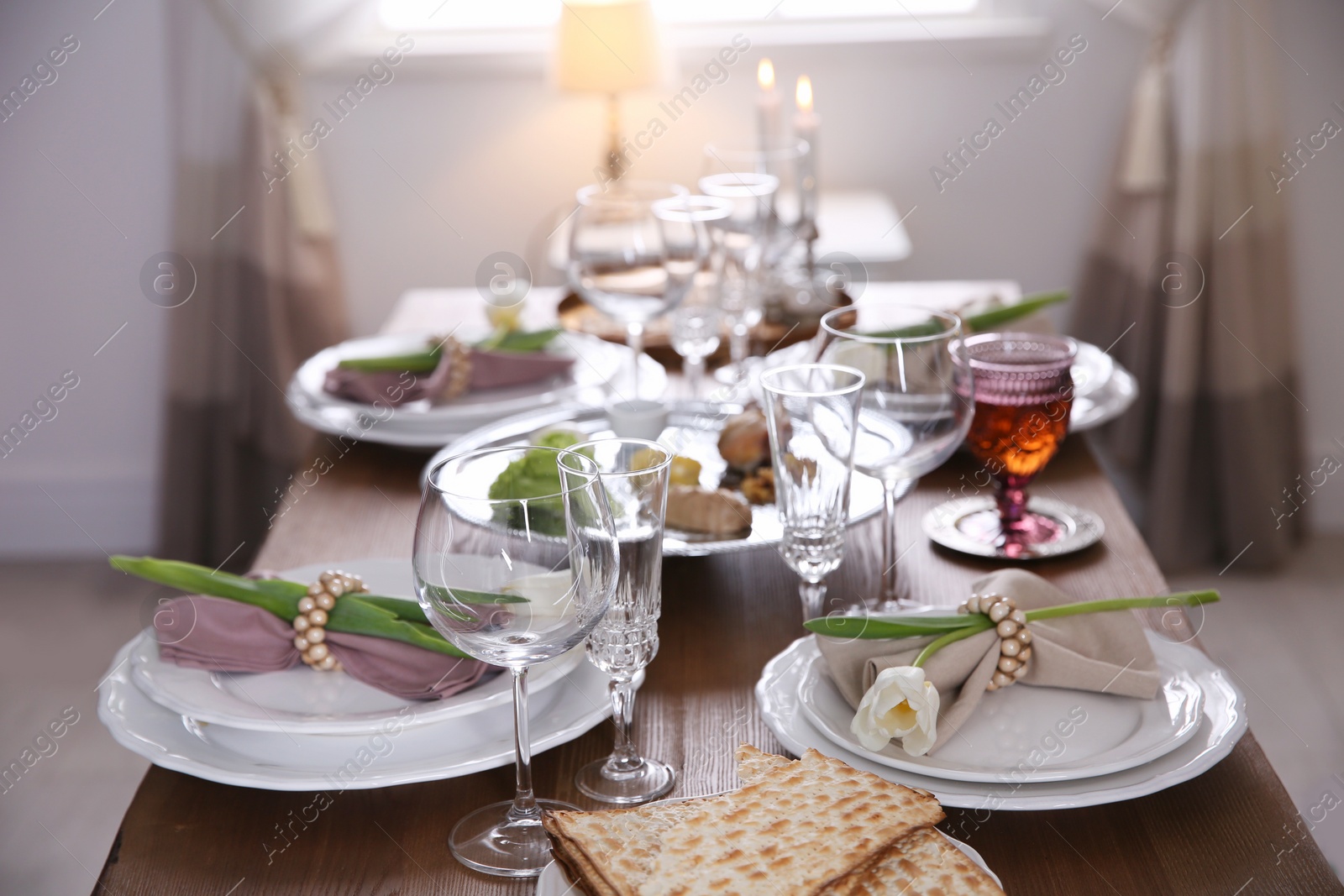 Photo of Festive Passover table setting at home. Pesach celebration