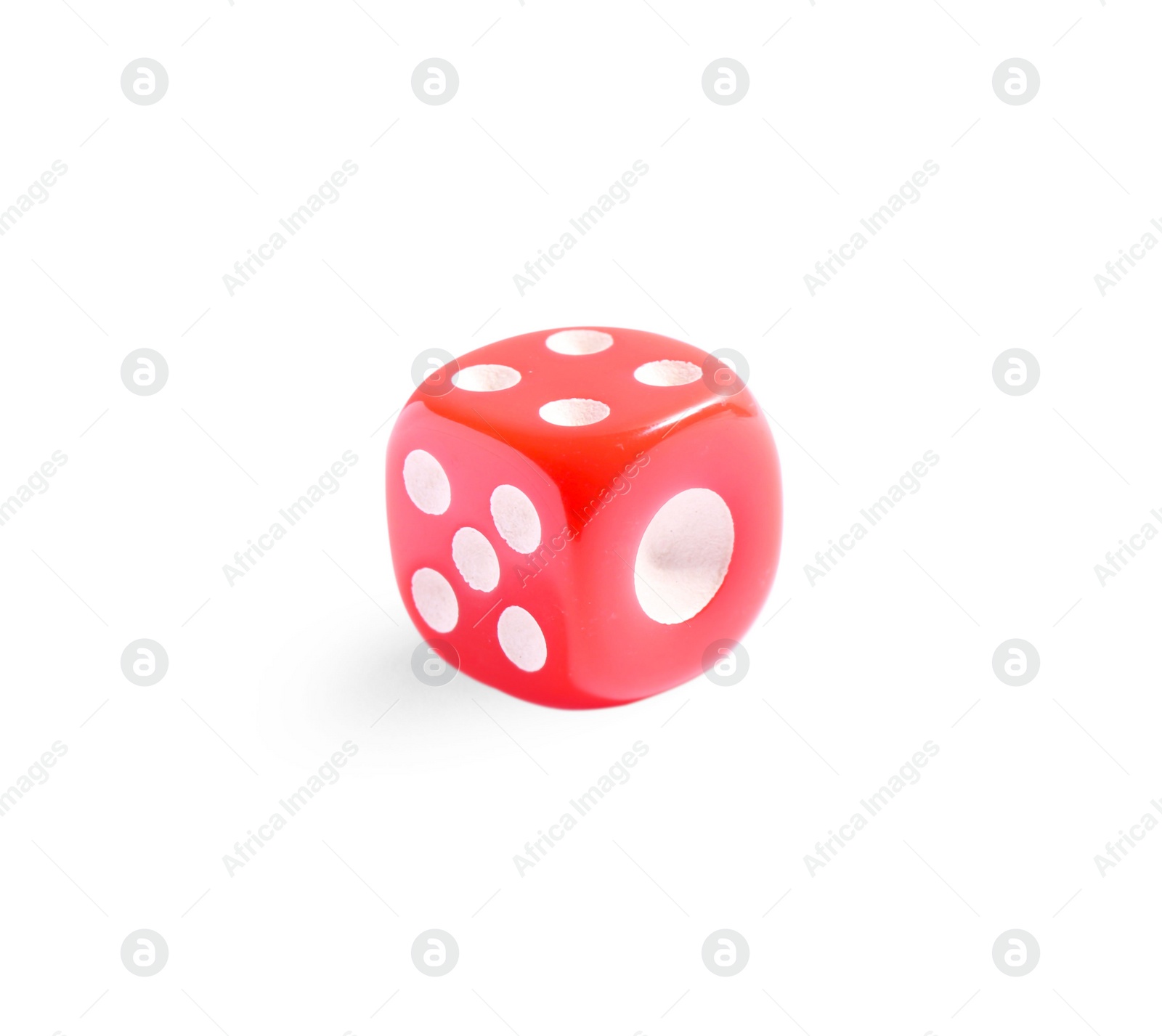 Photo of One red game dice isolated on white