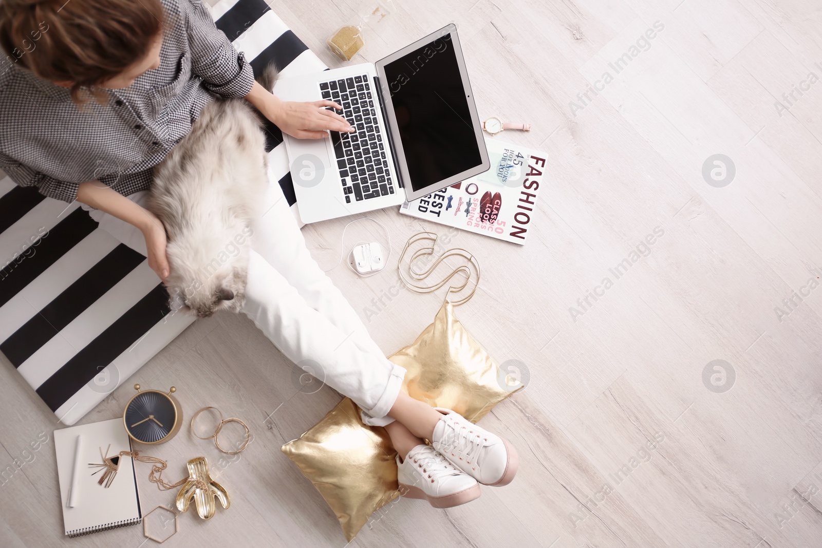 Photo of Female blogger with laptop and cat indoors, top view
