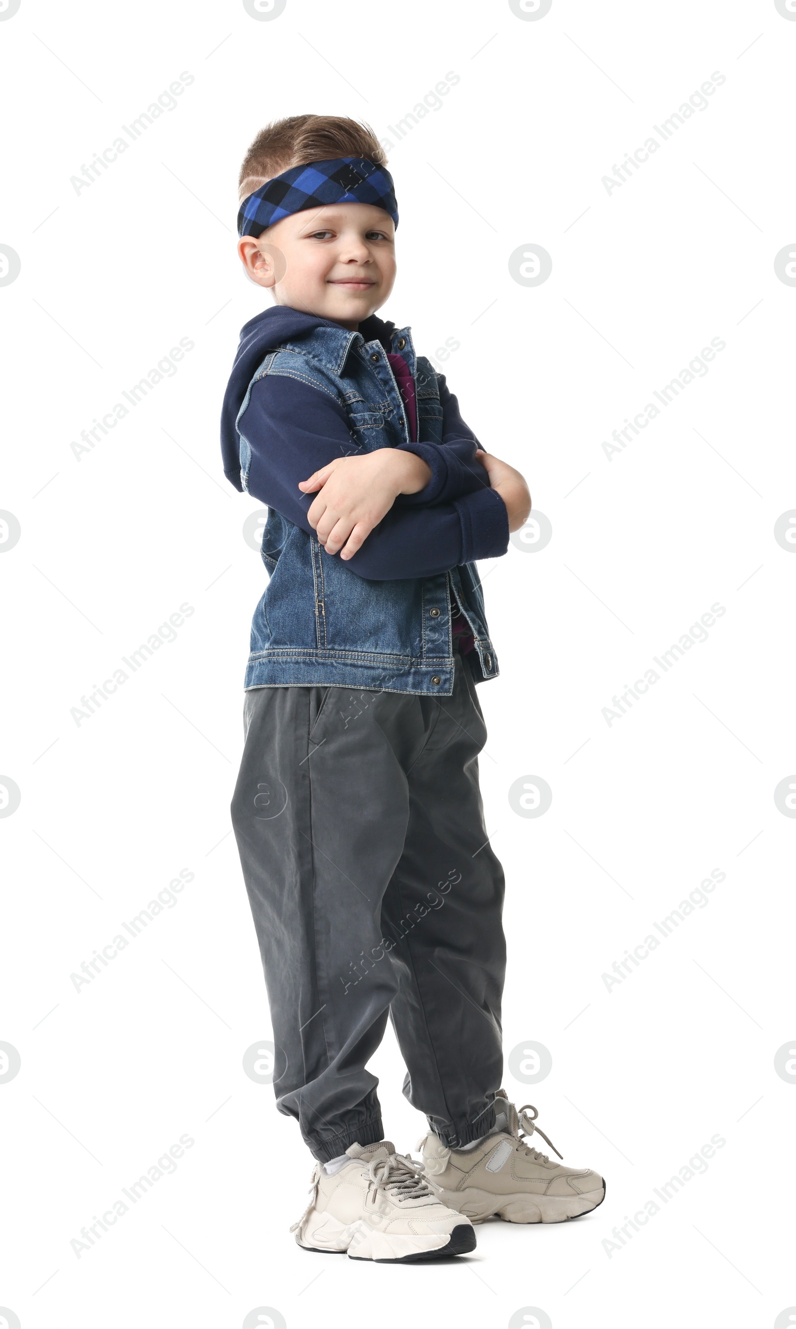 Photo of Happy little boy dancing on white background