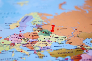 Photo of Pinned Ukraine on map of Europe, closeup. International relationships