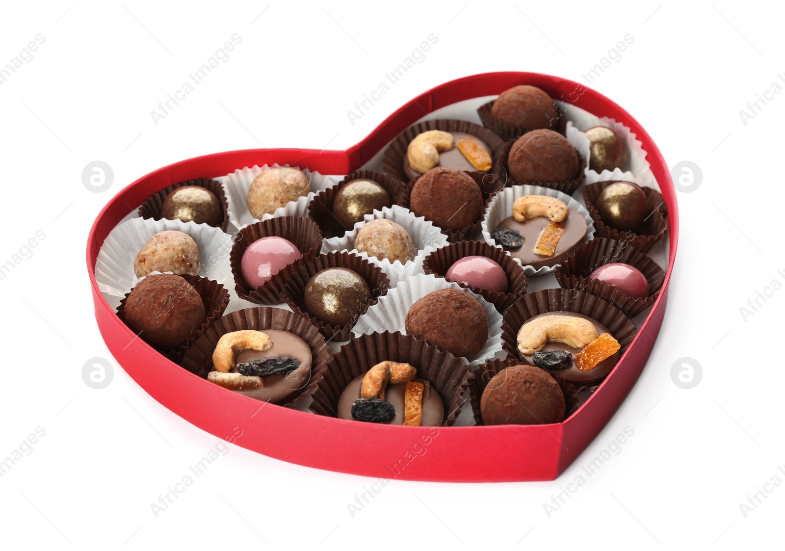 Photo of Delicious chocolate candies in heart shaped box on white background